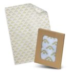 A sheet of decorative transparent paper with a gold geometric pattern is partially folded. Next to it is a brown cardboard box with a clear window, displaying the same patterned paper inside.