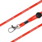 Close-up of a red lanyard with the word Honeywell printed in white. It features a silver clasp and an adjustable black plastic slider.