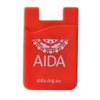 Orange card holder with the text AIDA and a logo featuring circular patterns above it. The website aida.org.au is printed below.