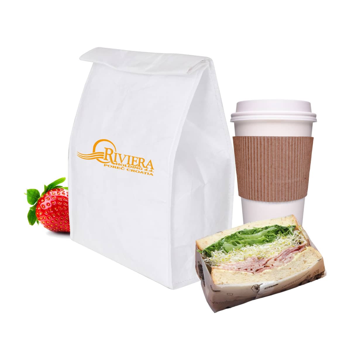A paper bag with Riviera branding is next to a coffee cup with a brown sleeve. In front are a sandwich with lettuce and ham and a fresh strawberry.