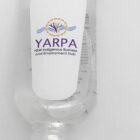 A clear plastic bottle with a carabiner clip, featuring a label that reads YARPA NSW Indigenous Business and Employment Hub with a logo above. The bottle is likely used for a liquid, such as hand sanitizer.