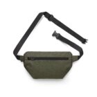 A green fabric crossbody bag with a main zippered compartment and an adjustable black strap featuring a plastic buckle.