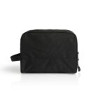 A black rectangular toiletry bag against a white background. It has a zippered main compartment, a small side handle on the left, and appears to be made of smooth fabric.