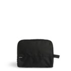 A simple black toiletry bag against a white background. The bag has a rectangular shape, a zipper closure along the top, and a small handle on the side. A logo tag is visible near the bottom front corner.