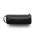 Black cylindrical toiletry bag with a zipper and a small handle on one side. The brand label ascolour is visible on the side of the bag. The bag is placed against a neutral white background.
