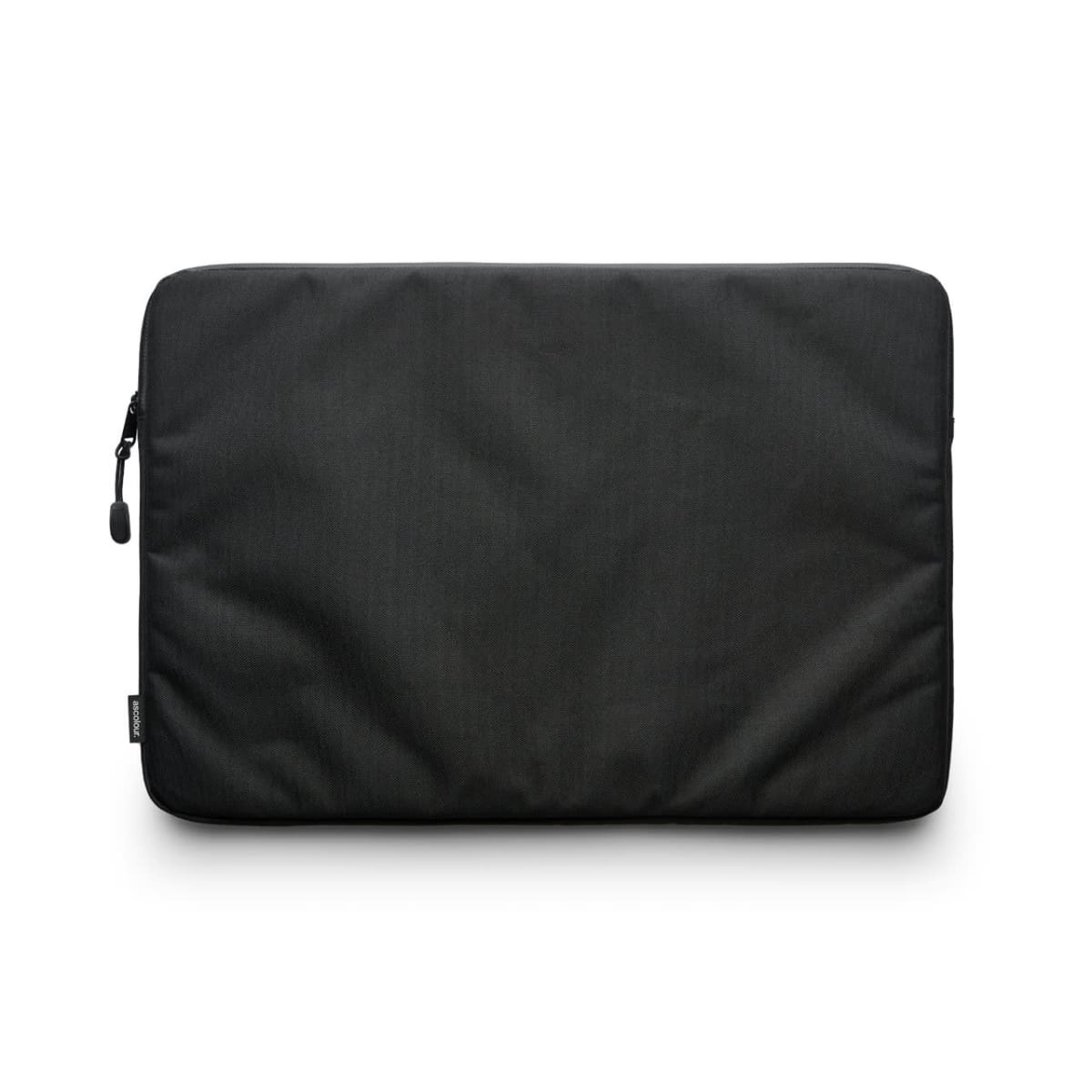 A black laptop sleeve with a zipper closure on the left side, set against a white background. The sleeve has a minimalistic design and a small tag on the left edge.