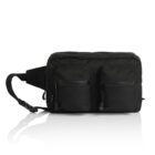 A black rectangular crossbody bag with two front zippered pockets and an adjustable strap. The design is sleek and minimalist, suitable for casual or travel use. The bag is placed against a white reflective surface.