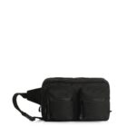 A black sling bag is pictured against a white background. It features two front zippered pockets and an adjustable strap. The design is minimal and functional.
