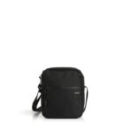 A black shoulder bag with a front zipper pocket and adjustable strap. The bag is standing upright on a reflective white surface.