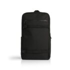 A sleek black backpack with a minimalist design, featuring a large main compartment and a smaller front zippered pocket. Straps and buckles are visible, and it stands upright against a plain white background.