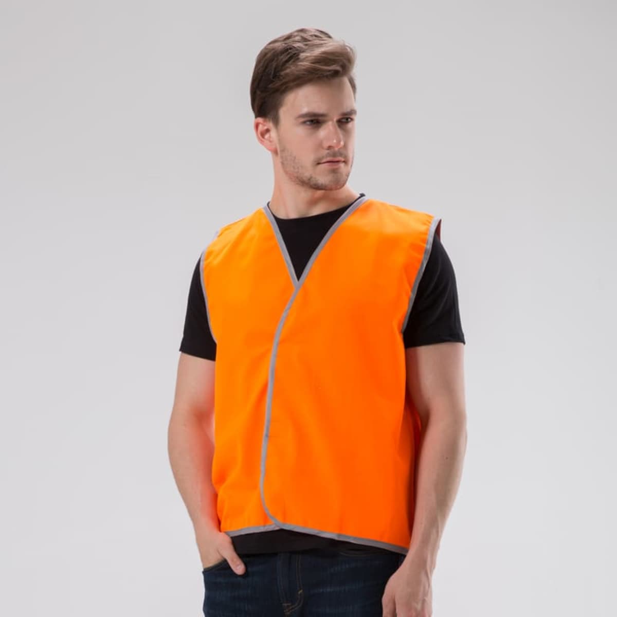 Man in a BrightShield Vest over a black shirt against a plain background.