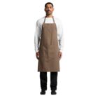 A person standing and facing forward, wearing a brown apron over a white long-sleeve shirt and black pants. They have short hair and a mustache, and are wearing black shoes. The background is white.