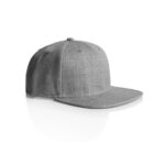 A gray, flat-brimmed baseball cap is pictured on a white background. The cap has six panels and a button on top, creating a simple and modern appearance. Shadows are visible beneath the cap, suggesting a studio lighting setup.