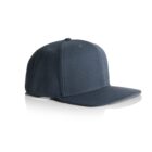 A plain dark gray baseball cap with a flat brim, shown on a reflective white surface. The cap is facing left, emphasizing its simple design and fabric texture.
