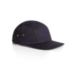 A black, five-panel cap with a flat brim. It features two small metal grommets on each side for ventilation. The cap has a minimalist design and is shown on a white background, angled slightly to display the side and front.