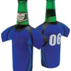 Two green glass bottles of Heineken beer are inside blue jersey-shaped bottle holders. The jerseys have a black and blue design on the front and the number 06 printed in white on the back.