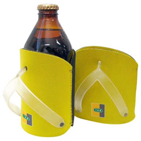 Two yellow bottle holders with sturdy handles, displaying a logo with TAB in green and black on one side, and holding a dark brown glass bottle.