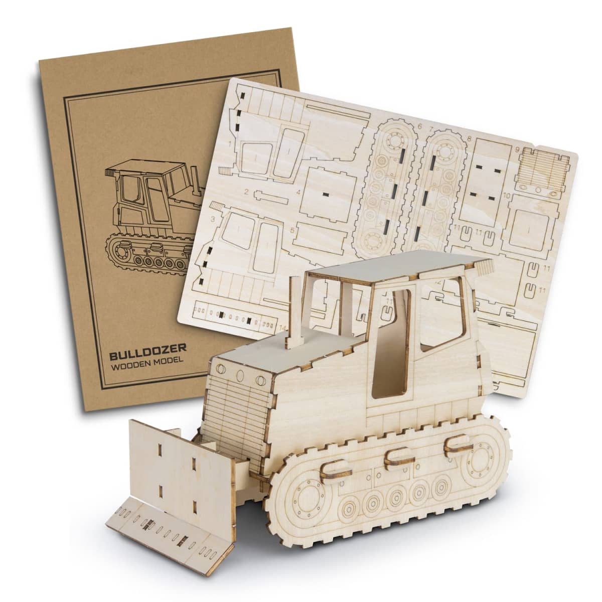A flat-pack wooden model kit of a bulldozer is displayed, consisting of a constructed model and unassembled wooden sheets with cutout pieces. The kit packaging is visible in the background.