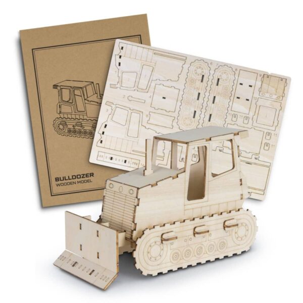 A wooden bulldozer model with laser-cut puzzle pieces is displayed in front of a cardboard package showing an assembly diagram. The assembled model and unassembled sheets are both included, showcasing the intricate design.