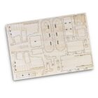 Wooden model kit sheet with laser-cut parts for assembly, including gears, panels, and various shapes laid out flat on a rectangular board.
