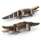 Wooden 3D puzzle of a crocodile, shown from two angles: top and side. The pieces are interlocked to form a realistic, detailed model with a textured design resembling a crocodiles appearance.