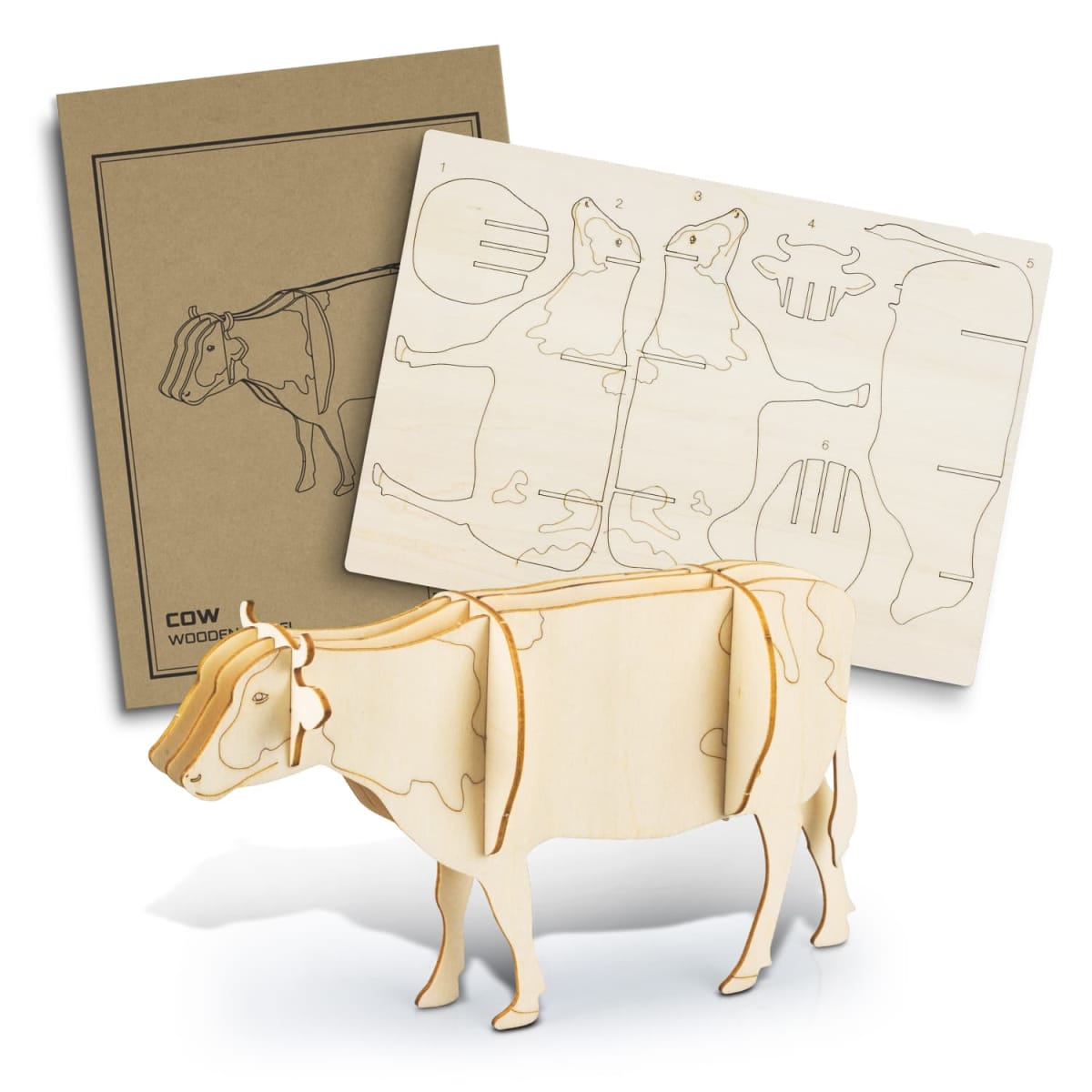 A wooden 3D puzzle of a cow is partially assembled, with unassembled pieces and an instruction sheet in the background. The cow model has simple details and stands on a flat surface.