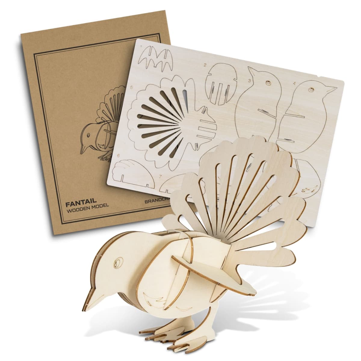 A 3D wooden model kit of a bird displayed with its pieces partially assembled. The kit includes a cardboard box and a wooden sheet with punch-out pieces. The bird, with a fan-shaped tail, is positioned in the foreground.