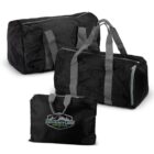 Three black duffel bags of varying sizes are pictured. Each bag features gray handles and zippers, with one bag displaying the Adventure Mountain logo. The bags are positioned against a white background.