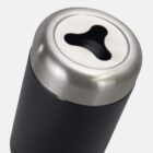 Close-up of a black cylindrical object with a metallic top, featuring a clover-shaped opening.