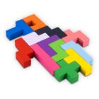 Colorful wooden puzzle blocks fit together on a white background.