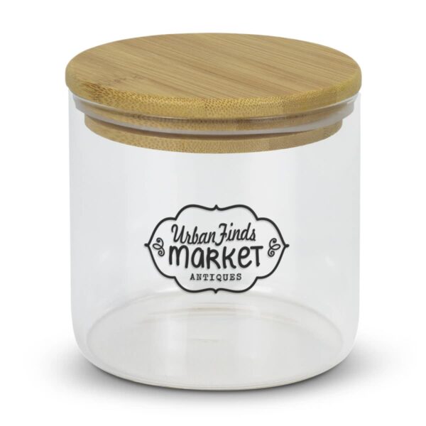 A clear glass jar with a wooden lid labeled Urban Finds Market Antiques. The jar is shown against a white background.