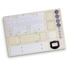 A flat cardboard sheet with die-cut parts for assembling a miniature model bus, featuring sections labeled with numbers and shapes for precision in construction.