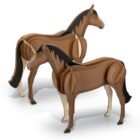 Two wooden horse models with brown bodies, black manes, and tails, standing on a white surface. The models appear to be made of layered wooden pieces fitted together.