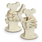 Two wooden 3D puzzles of koalas sitting on tree branches. Each koala features simplified shapes with engraved facial features and details. The models are displayed on flat round bases.