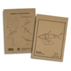 Two cardboard sheets featuring a wooden shark model kit. The front shows an illustration of the shark model with a stand and the text Shark Wooden Model. The back has assembly instructions with diagrams and steps.