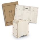 A flat-pack wooden model kit for a money box is shown. The image displays the assembled money box, the unassembled wooden pieces, and the cardboard packaging labeled Money Box Wooden Model.
