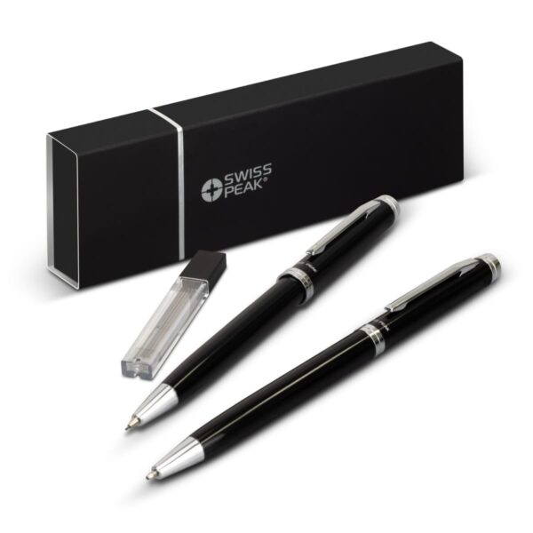 A sleek black and silver Swiss Peak pen set is displayed, featuring a ballpoint pen and a rollerball pen. Accompanying the pens is a black rectangular case and an extra ink refill, all set against a white background.