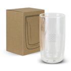 A transparent glass tumbler with the logo CALYPSO and wave design is placed next to a cardboard box. The box features a simple line drawing of the tumbler. The tumbler is double-walled.