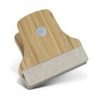 A wooden and plastic clip with a bamboo finish and a beige speckled base is shown. It features a small metal circle near the top for added style or function. The clip is positioned upright against a plain white background.