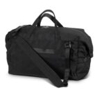 A large black duffel bag with sturdy handles and an adjustable shoulder strap. The bag has a zipper closure on the top and appears spacious, suitable for travel or gym use.
