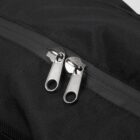 Close-up image of a black fabric bag featuring a zipper with two metallic pulls. The zipper teeth and pulls are silver, providing a contrast against the dark material. The fabric has a subtle textured finish.