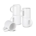 Four white ceramic mugs are stacked, two upright and two upside down, forming two separate columns. Another mug lies on its side in front of the stacks. All mugs have simple, smooth designs with handles.