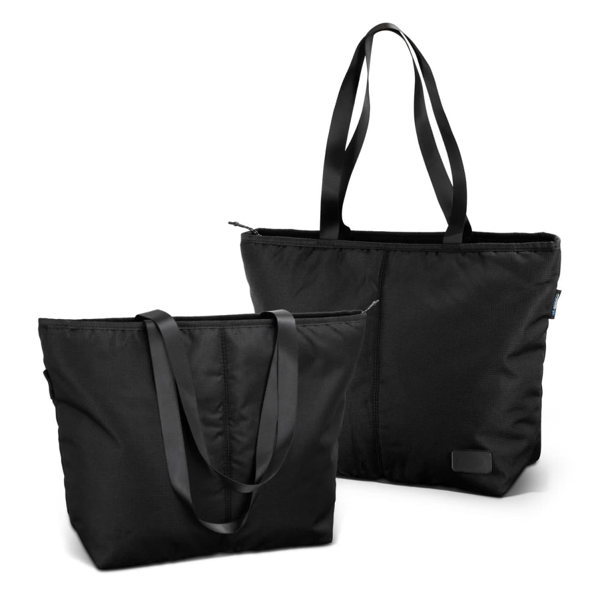 Two black tote bags with long handles are displayed. One bag is upright, while the other is angled. Both have a zippered top and a sleek design.