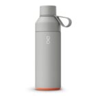 A sleek, light gray water bottle with an orange base and a looped cap. The bottle has a minimalist design with a subtle logo on the front.