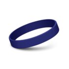 A solid blue silicone wristband on a white background, shown at a slight angle, casting a soft shadow beneath it.