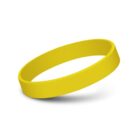 A yellow silicone wristband is displayed against a white background. The band is smooth, with no visible text or design, casting a slight shadow underneath.