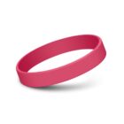 A solid pink rubber wristband displayed on a white background, casting a soft shadow beneath it.