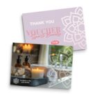 A spa and beauty voucher for $150 from Mandalla Spa and Hotel. The design includes a decorative floral pattern, and images of spa essentials like candles and oil bottles. The text reads Thank You and Revitalise Fresh Revive.