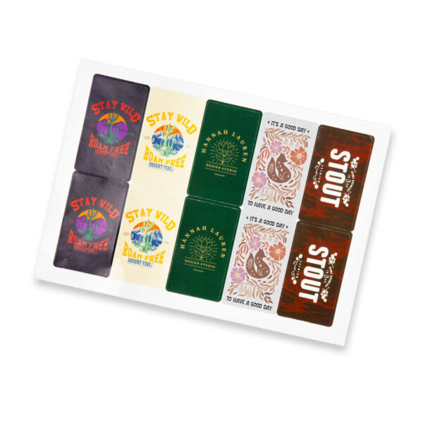 A set of decorative cards with various designs and texts. Designs include vintage logos, the phrase Stay Wild Roam Free, floral patterns, and STOUT. Colors range from dark to pastel tones on different card backgrounds.