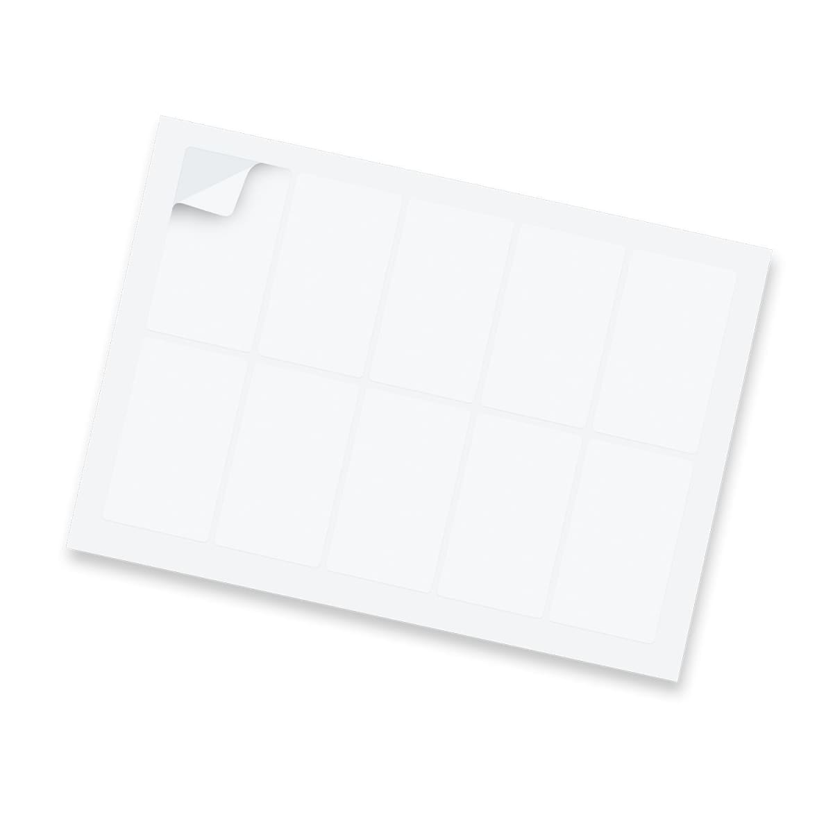 A sheet of blank, white rectangular labels with rounded edges, featuring nine labels in total. One label in the top left corner is partially peeled, revealing a slightly sticky surface beneath. The sheet is positioned at a slight angle.
